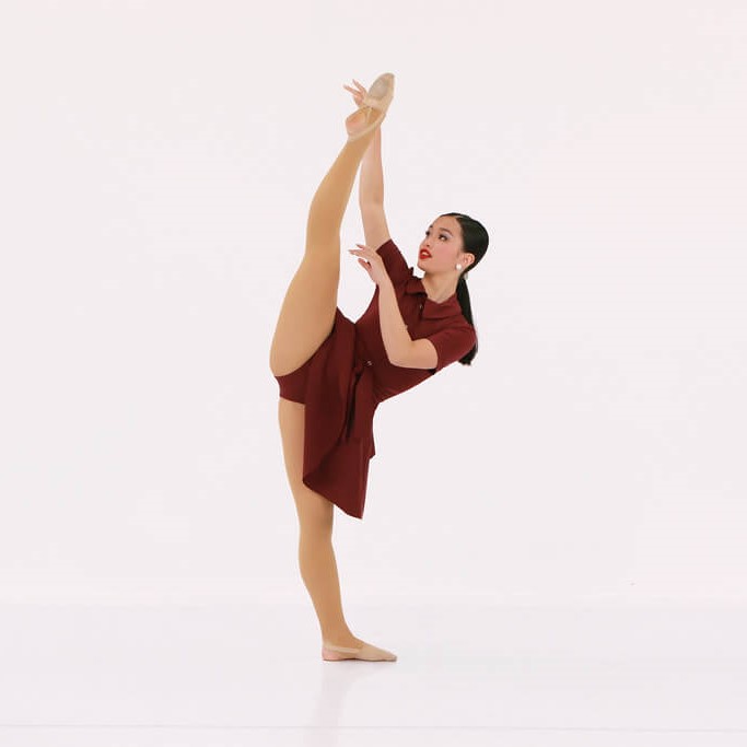 contemporary dancer from The Dance Shoppe in Milton in a contemporary dance pose wearing a maroon dance costume