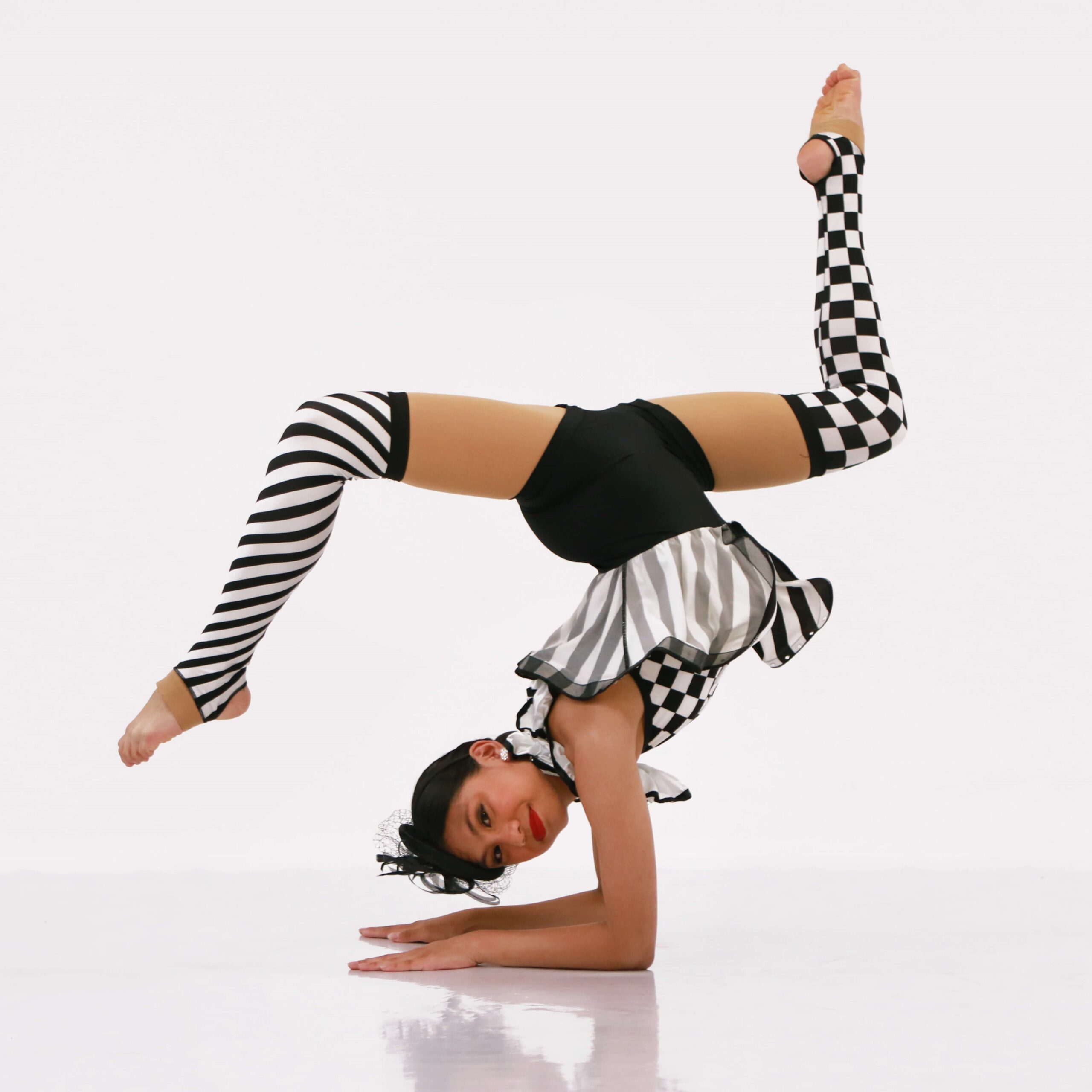acro dance class dancer in Milton Ontario doing an upside down acrobatic dance pose
