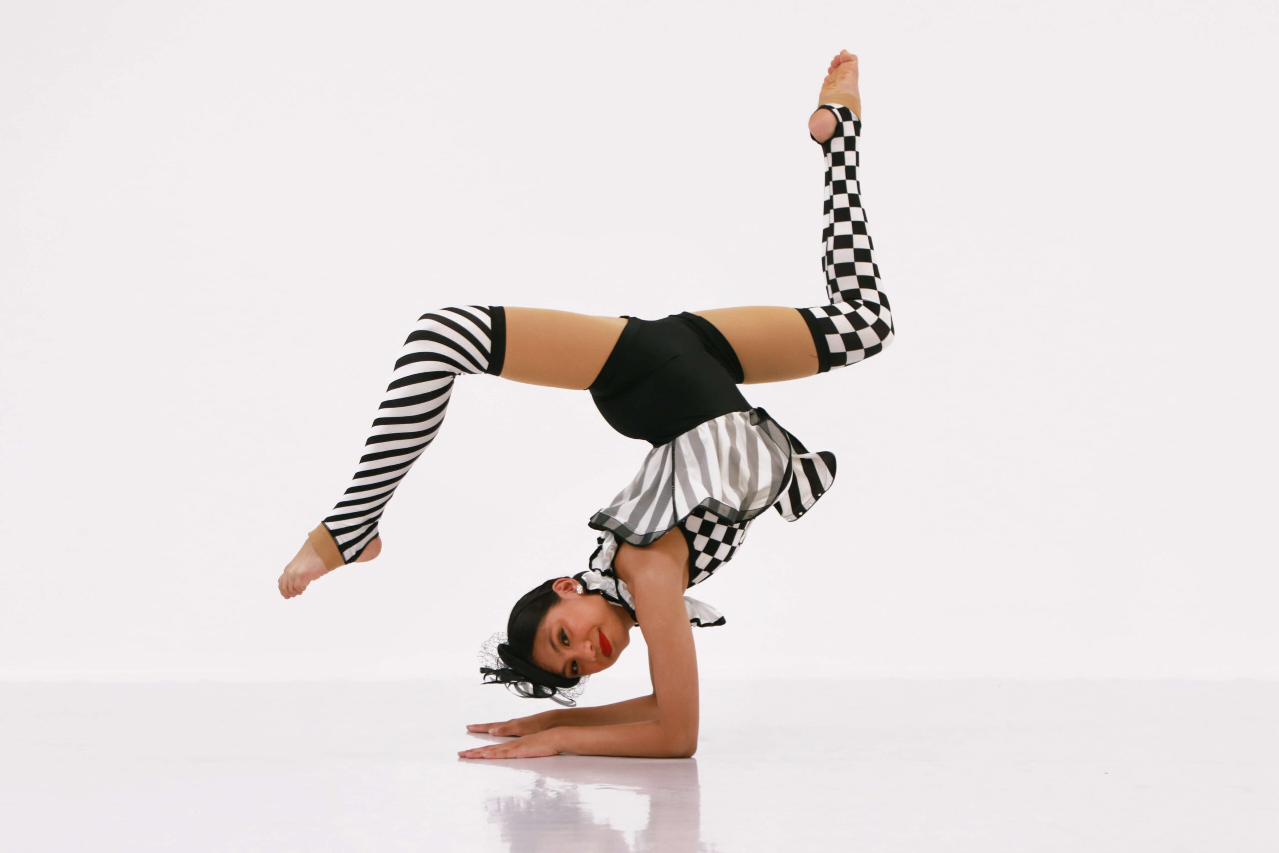 acro dance class dancer in Milton Ontario doing an upside down acrobatic dance pose