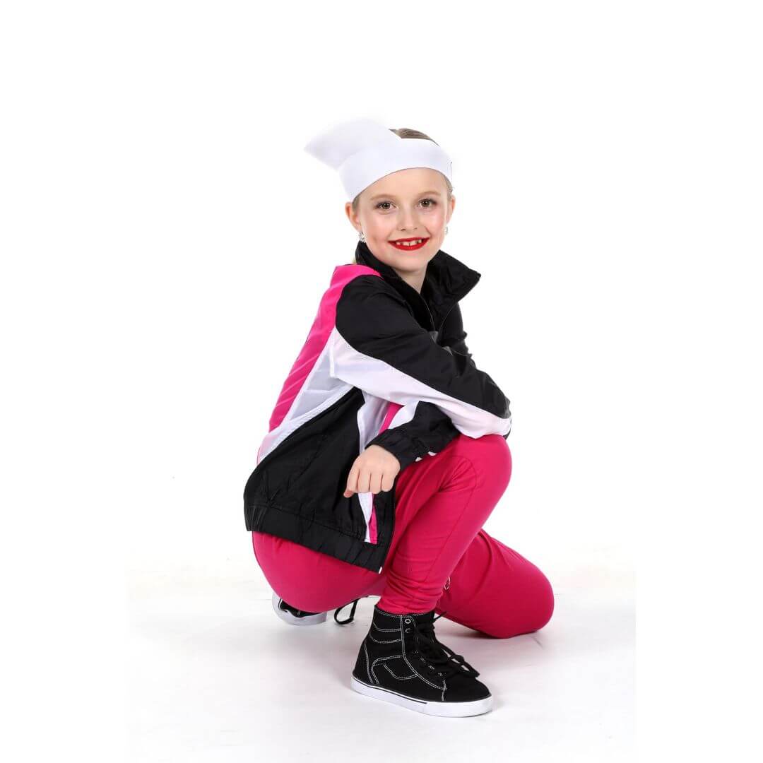 9 year old hip hop dancer in white with a pink construction vest doing a hip hop pose at The Dance Shoppe in Milton